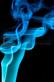 Abstract blue smoke over black background