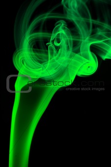 Abstract green smoke over black background