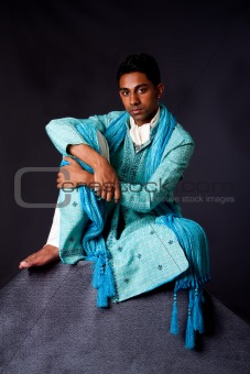 Hindu man sitting on rock