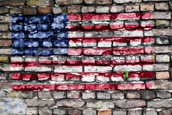 Flag of USA painted on an old brick wall
