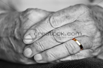 Old hands with wedding band