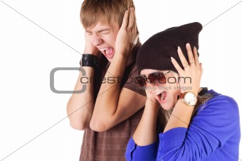 Young couple screaming.