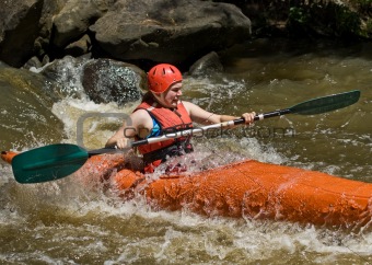 teenage girl white water kayaking