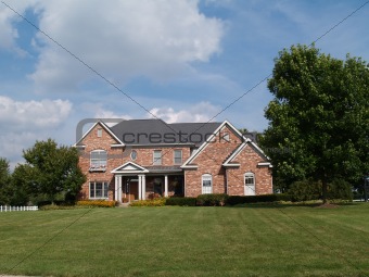 Two story large brick home.