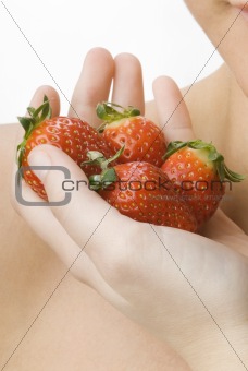 the hand full of strawberry