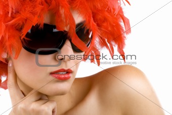 woman with red feather wig and sunglasses