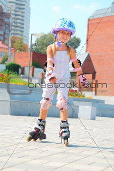 child on inline rollerblade skates