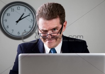 Crazy Businessman on Laptop Computer