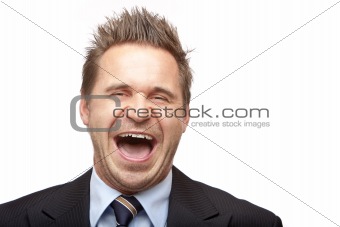 Businessman laughs into camera