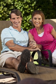 Successful Happy Middle Aged Man and Woman Couple Holding Hands