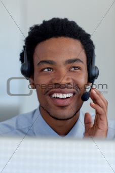 Afro-American businessman in a call center
