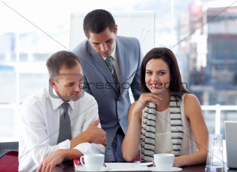 Young businesswoman working with colleagues