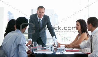 Business people studying a new plan in a meeting