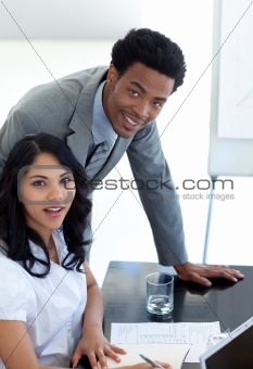 Afro-American businessman working with his colleague