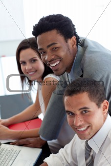 Business team working together with a laptop