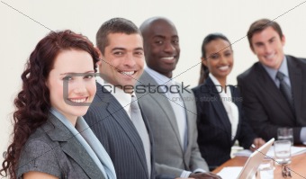 Business people sitting in a meeting and smiling