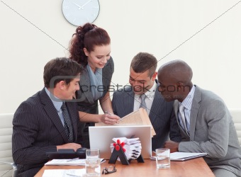 Businessmen in a meeting talking to a secretary