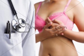 Doctor and woman on pink bra
