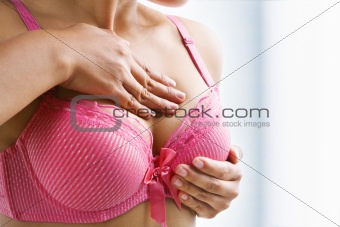Woman doing self breast examination