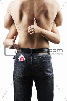 Pointing red condom on man pocket