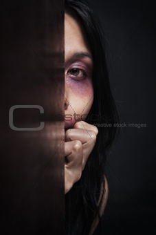 Injured woman hiding in dark