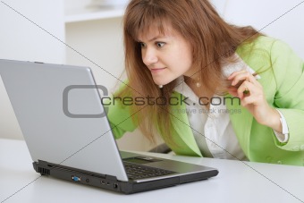 Girl is angry with the laptop and Internet