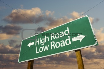High and Low Road Green Road Sign with dramatic blue sky and clouds.