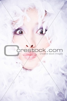portrait of amazing young woman with boa over her face (focus on lips)