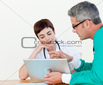 Doctor and surgeon at a meeting