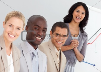 Smiling business team sitting in a meeting in the office