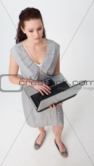 High angle of a thoughtful businesswoman using a laptop