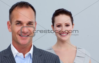 Portrait of a smiling beautiful businesswoman with her male colleague