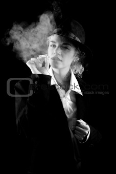 Beautiful girl in a suit, smoking