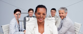 Afro-American businesswoman smiling in a meeting
