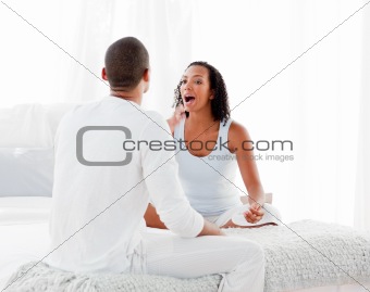 Couple on bed having an argument