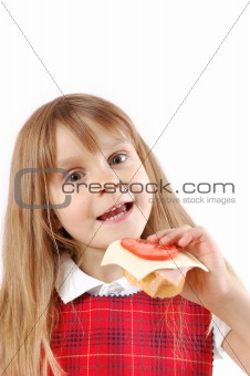 child eating a sandwich