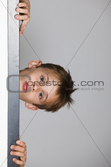 Boy looking through the doorway