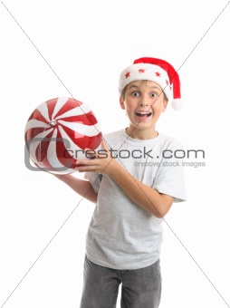 Child boy holding Christmas bauble decoration