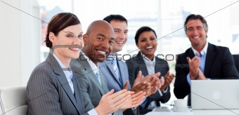 Portrait of an international business team clapping
