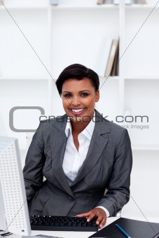 Beautiful female executive working at a computer