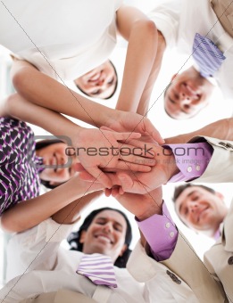 International business people holding hands together 