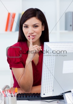 Portrait of an attractive businesswoman asking for silence