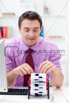 Portrait of a businessman searching for the index 