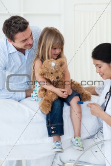 A doctor checking child's