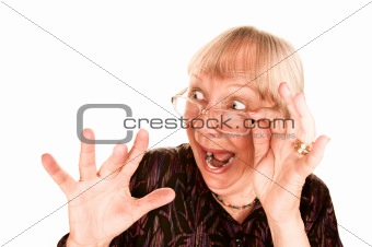 Shocked senior woman looking over the top of her glasses