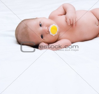 baby lying on the bed