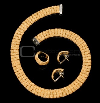 Set of earrings, ring and golden bracelet with diamonds