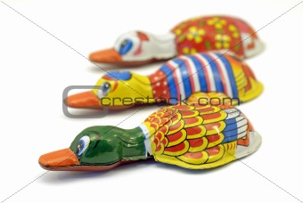 three toy ducks