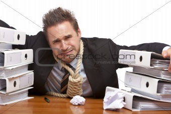 Stressed business man with rope lasso around neck is crying in o