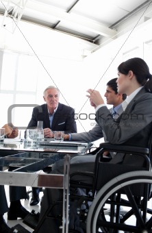 Businesswoman in a wheelchair during a meeting